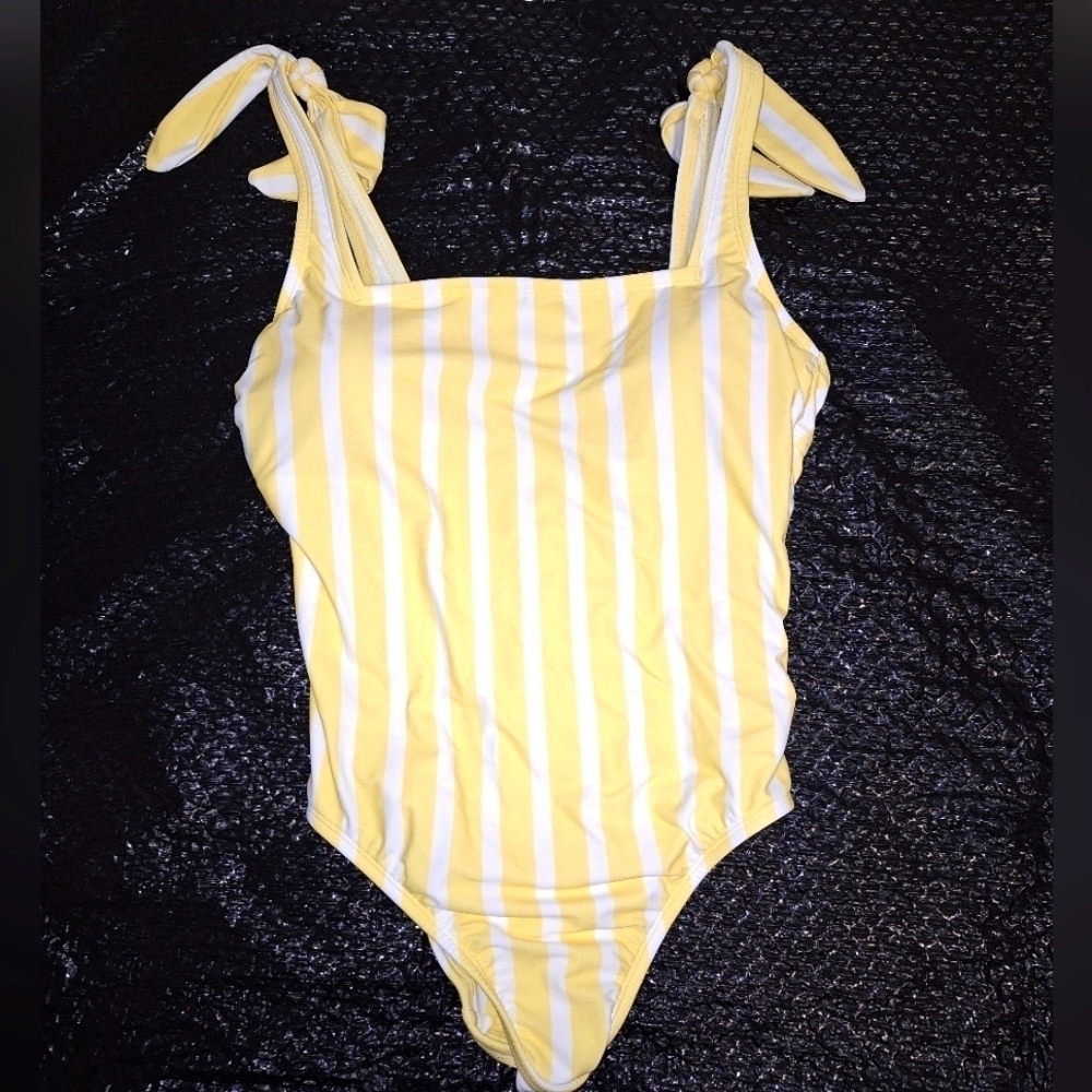 A Kona Sol yellow striped one-piece bikini in a size medium with shoulder ties.